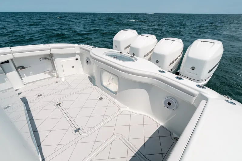  Yacht Photos Pics 2017 Yellowfin 42 boat deck with four outboard engines on open sea.