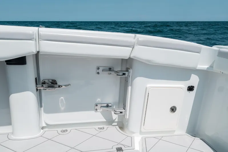  Yacht Photos Pics 2017 Yellowfin 42 boat interior with ocean view, featuring white deck and storage compartments.