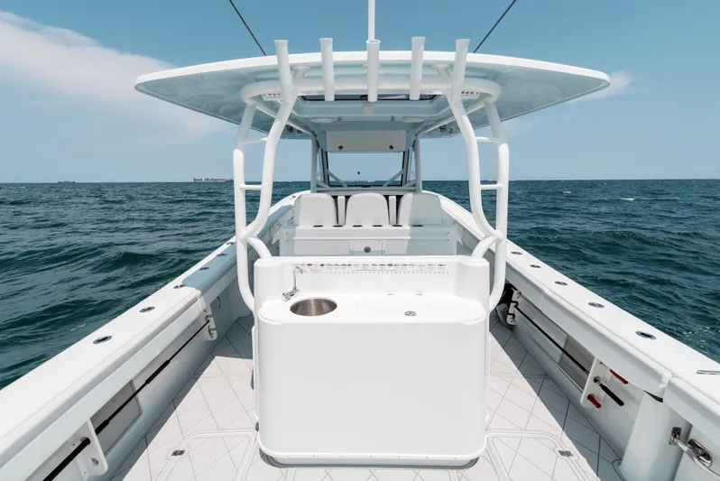  Yacht Photos Pics 2017 Yellowfin 42 boat on open sea, showcasing spacious deck and seating.