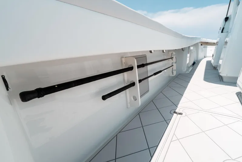  Yacht Photos Pics 2017 Yellowfin 42 boat deck with rod holders and sleek white design.