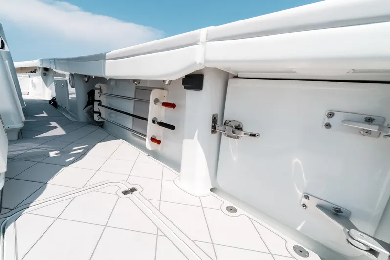  Yacht Photos Pics 2017 Yellowfin 42 boat interior with storage compartments and rod holders.