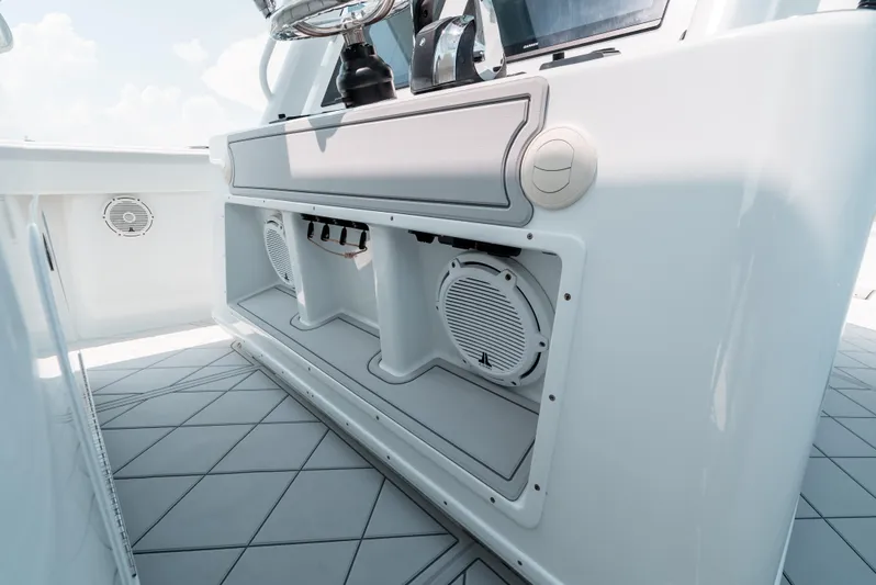  Yacht Photos Pics 2017 Yellowfin 42 boat interior with speakers and storage compartments.