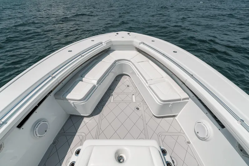  Yacht Photos Pics Bow seating area of a 2017 Yellowfin 42 boat on the water.