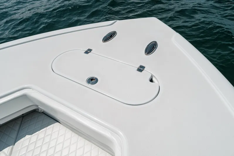  Yacht Photos Pics Bow of 2017 Yellowfin 42 boat with storage compartment, on water.