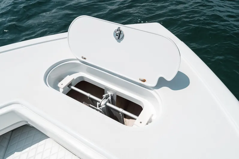  Yacht Photos Pics 2017 Yellowfin 42 boat anchor compartment open on calm water.