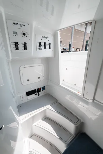  Yacht Photos Pics Interior of a 2017 Yellowfin 42 boat, featuring control panels and seating.