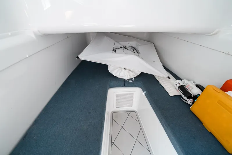  Yacht Photos Pics Interior storage space of a 2017 Yellowfin 42 boat, featuring organized equipment and accessories.