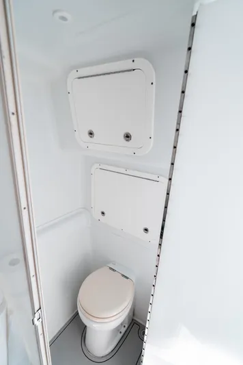  Yacht Photos Pics 2017 Yellowfin 42 boat bathroom interior with white fixtures and compact design.