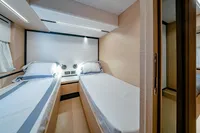 2024 Solaris Power 60 Open yacht cabin with twin beds and modern design.