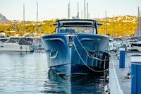 2024 Solaris Power 60 Open yacht docked in a marina, showcasing sleek design and luxury.
