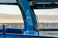 2024 Solaris Power 60 Open yacht, sleek design, sunset backdrop.