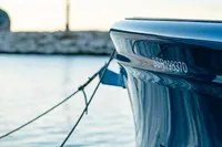 2024 Solaris Power 60 Open yacht moored, showcasing sleek design and elegant blue hull.
