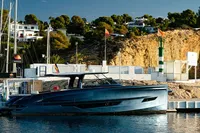 2024 Solaris Power 60 Open yacht docked in a scenic marina setting.