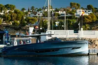 2024 Solaris Power 60 Open yacht docked in a scenic marina setting.