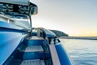 2024 Solaris Power 60 Open yacht on calm water at sunset.