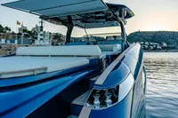 2024 Solaris Power 60 Open yacht docked at sunset, featuring sleek design and luxurious seating.