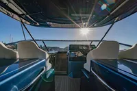 2024 Solaris Power 60 Open yacht interior with sunlit helm and luxurious seating.