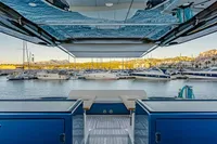 2024 Solaris Power 60 Open yacht docked in a marina, showcasing luxurious design and spacious deck.