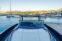 2024 Solaris Power 60 Open yacht docked in a scenic marina.