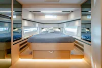 Luxurious bedroom interior of 2024 Solaris Power 60 Open yacht, featuring modern design and ambient lighting.