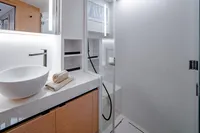 Luxurious bathroom in 2024 Solaris Power 60 Open yacht, featuring modern sink and shower.