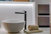 Modern bathroom sink with sleek faucet and towels on Solaris Power 60 Open yacht, 2024 model.