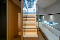 Luxurious interior of 2024 Solaris Power 60 Open yacht with modern staircase and seating area.
