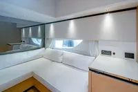 Luxurious interior of 2024 Solaris Power 60 Open yacht with modern white seating.