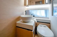 Modern bathroom interior on 2024 Solaris Power 60 Open yacht, featuring sleek design and fixtures.