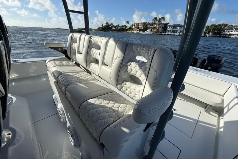  Yacht Photos Pics 2023 Contender 44 CB boat interior with luxurious seating and scenic water view.