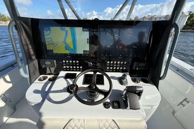  Yacht Photos Pics Cockpit of 2023 Contender 44 CB boat with advanced navigation displays and controls.