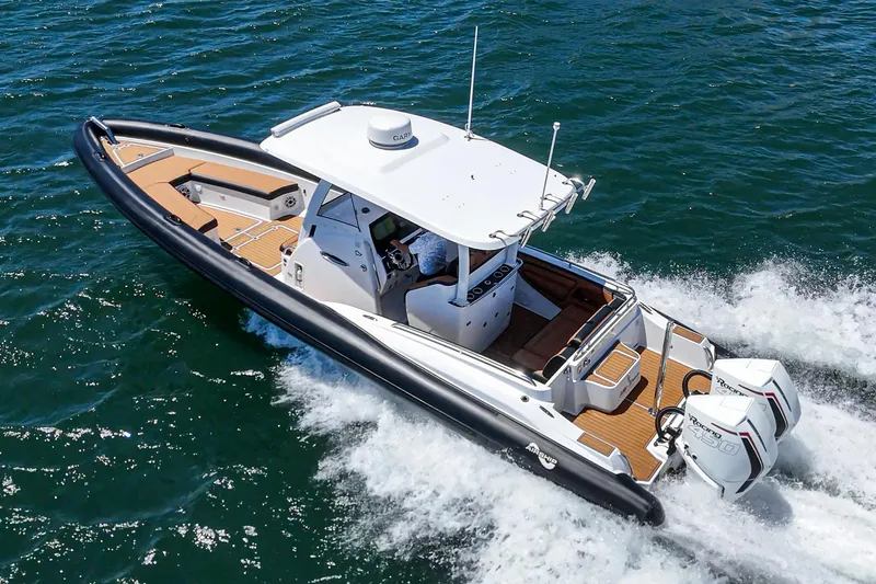 Jilly Bean Yacht Photos Pics 2025 Airship 340 boat cruising on open water, featuring sleek design and powerful engines.