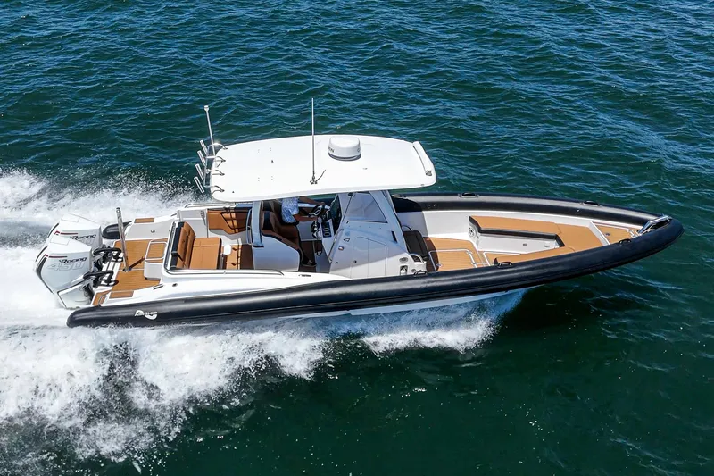 Jilly Bean Yacht Photos Pics 2025 Airship 340 boat cruising on open water, featuring sleek design and powerful engines.