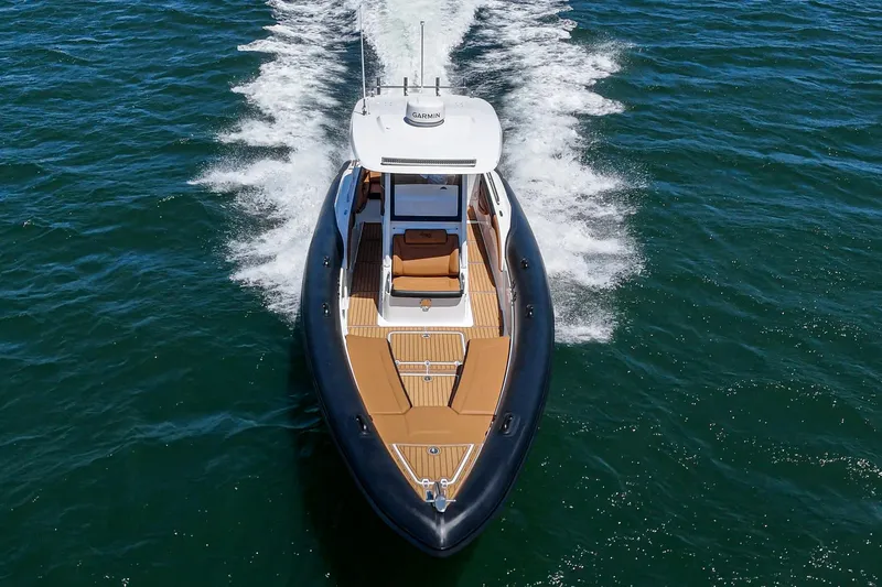 Jilly Bean Yacht Photos Pics 2025 Airship 340 boat cruising on open water, showcasing sleek design and powerful performance.