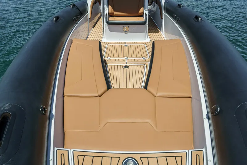 Jilly Bean Yacht Photos Pics Luxury deck of 2025 Airship 340 boat with tan seating and sleek design.