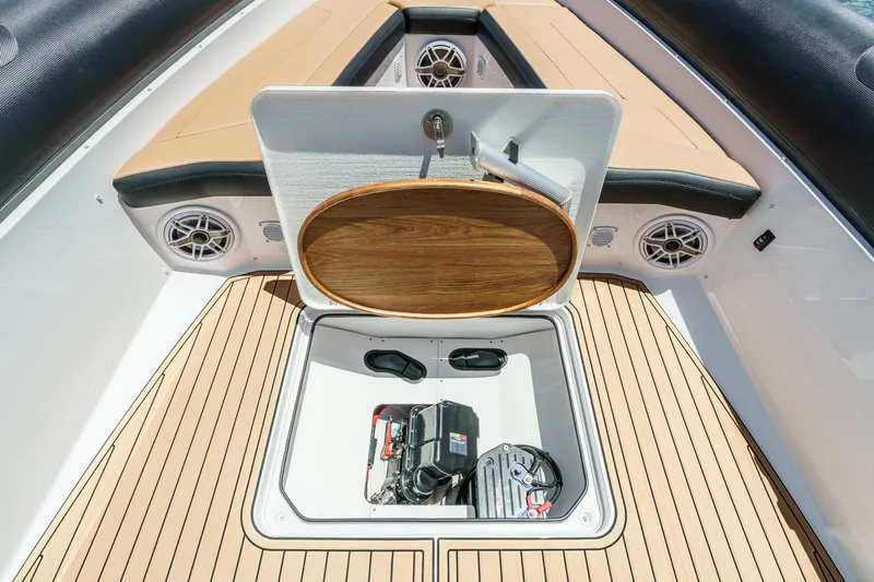 Jilly Bean Yacht Photos Pics Open storage compartment on Airship 340 boat, featuring teak flooring and cushioned seating, 2025 model.