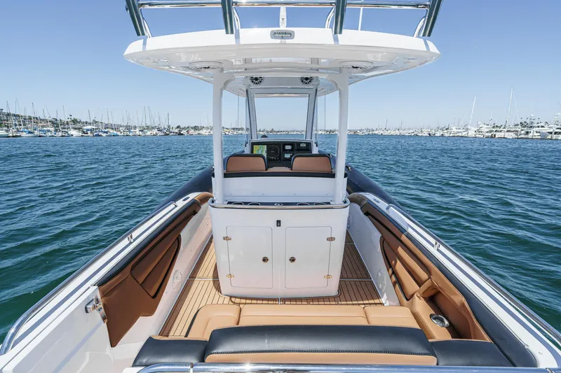 Jilly Bean Yacht Photos Pics 2025 Airship 340 boat interior with seating, console, and ocean view.