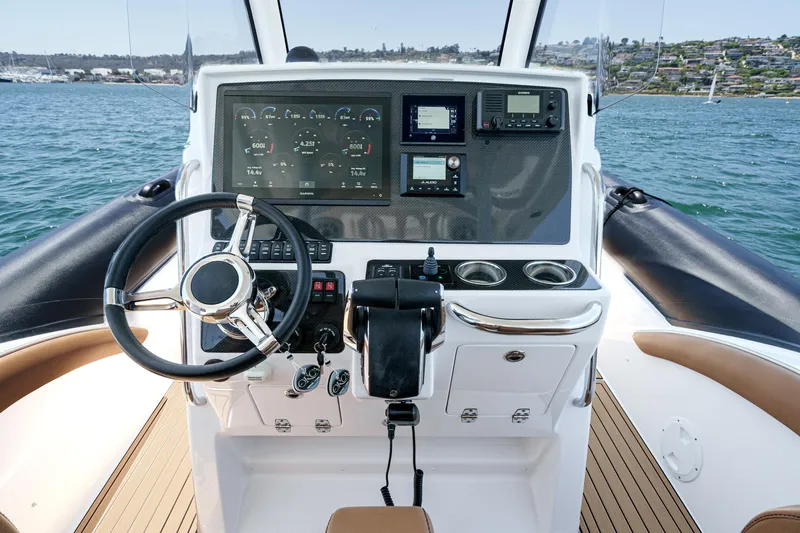 Jilly Bean Yacht Photos Pics Cockpit of 2025 Airship 340 boat with modern steering and navigation controls.