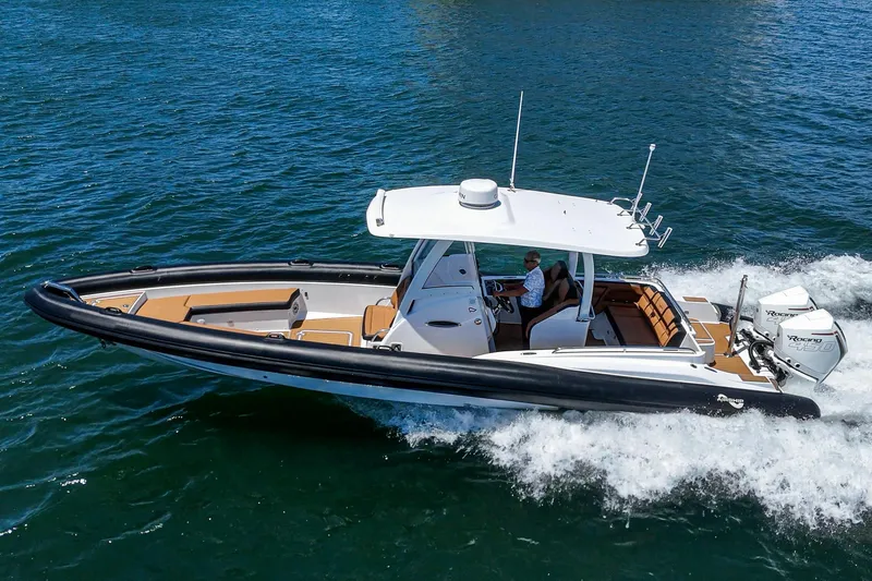 Jilly Bean Yacht Photos Pics 2025 Airship 340 boat cruising on open water, featuring sleek design and powerful engines.