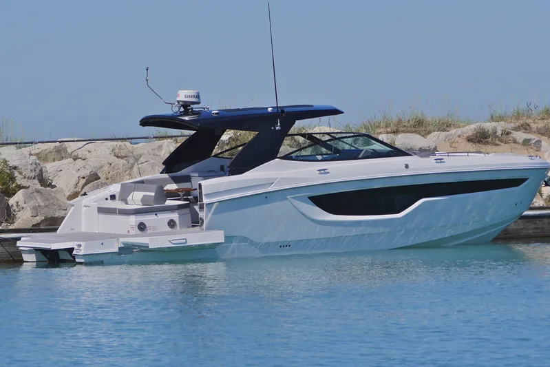  Yacht Photos Pics 2026 Cruisers Yachts 38 GLS I/O luxury boat docked in serene waters.