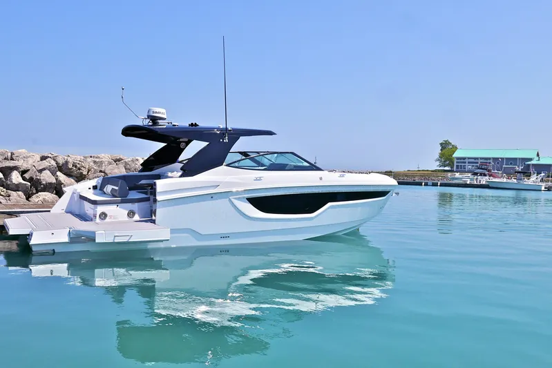  Yacht Photos Pics 2026 Cruisers Yachts 38 GLS I/O in a serene marina setting.