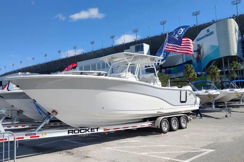  Yacht Photos Pics 2023 Sea Fox 328 Commander boat on trailer, displayed outdoors with American flag.