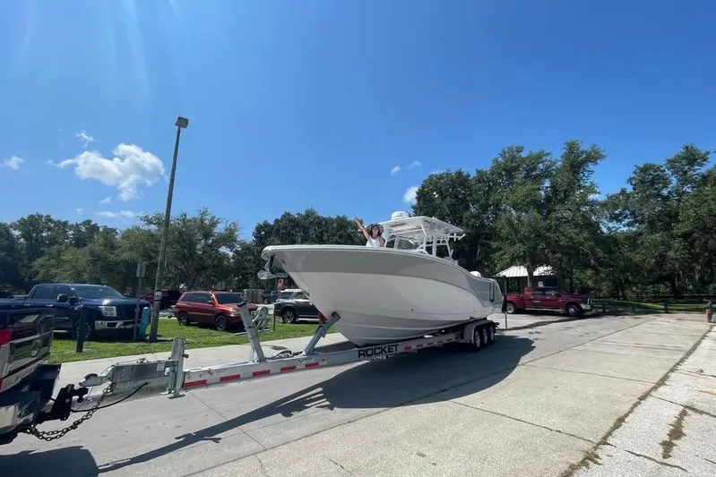  Yacht Photos Pics 2023 Sea Fox 328 Commander boat on trailer under clear blue sky.