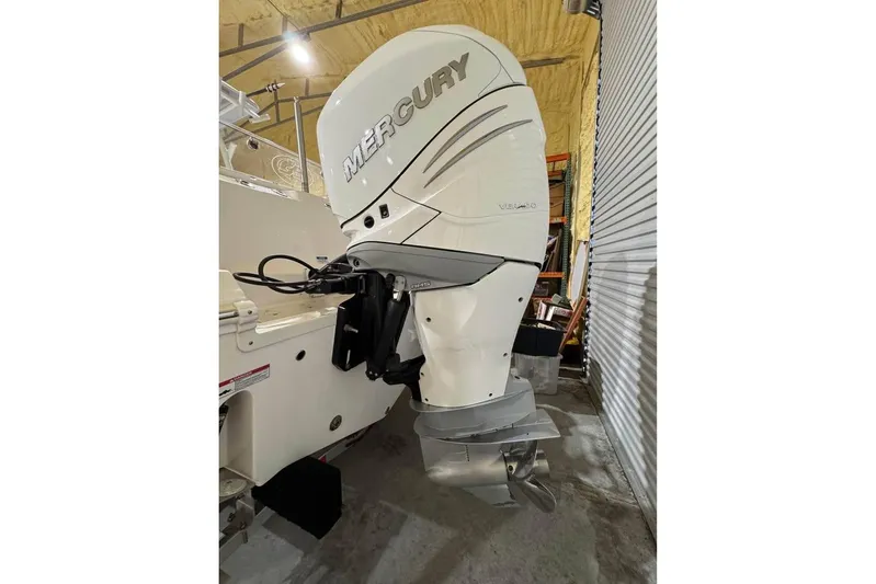  Yacht Photos Pics 2023 Sea Fox 328 Commander with Mercury outboard engine in a storage facility.