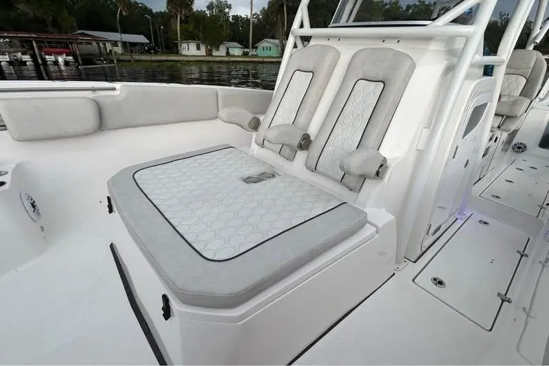  Yacht Photos Pics 2023 Sea Fox 328 Commander boat interior with cushioned seating and sleek design.