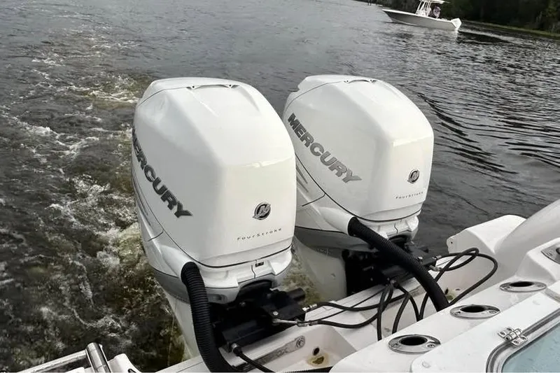  Yacht Photos Pics Twin Mercury outboard engines on a 2023 Sea Fox 328 Commander boat in water.