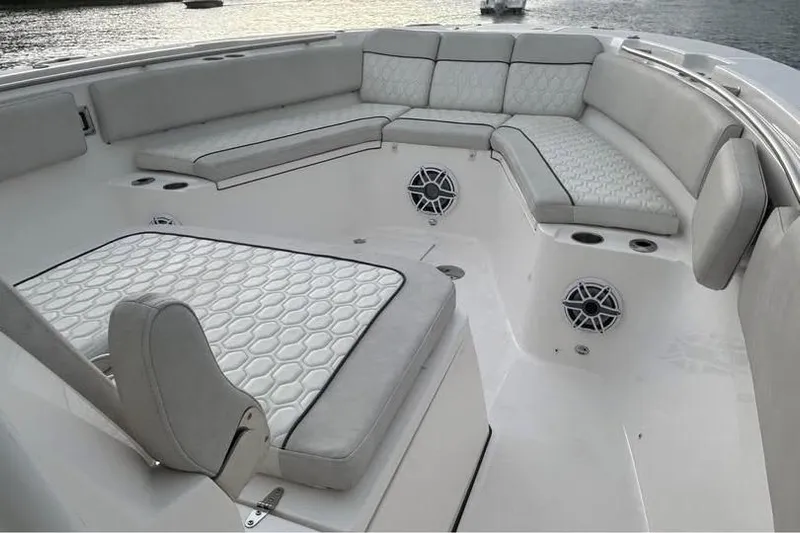  Yacht Photos Pics Luxurious seating area on 2023 Sea Fox 328 Commander boat, featuring elegant upholstery and speakers.