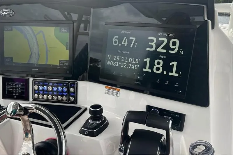  Yacht Photos Pics 2023 Sea Fox 328 Commander dashboard with GPS navigation and control systems.