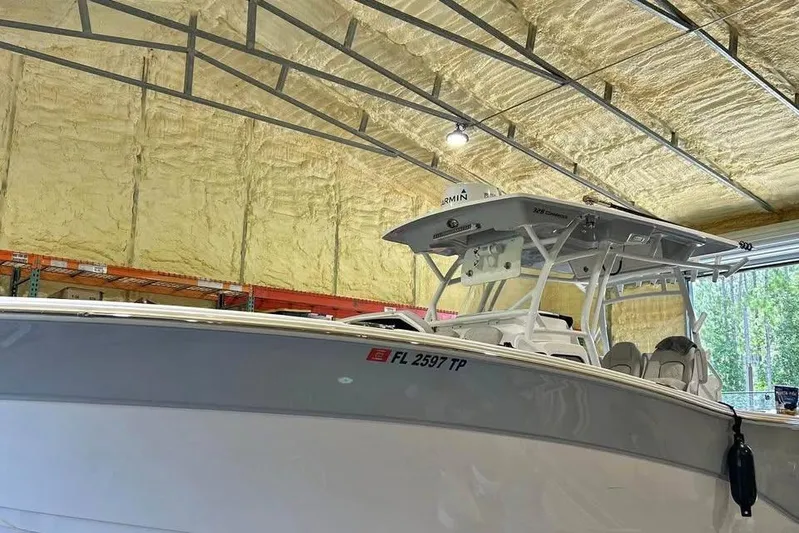  Yacht Photos Pics 2023 Sea Fox 328 Commander boat in a warehouse, showcasing sleek design and modern features.
