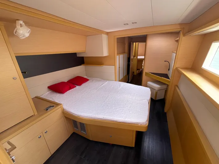  Yacht Photos Pics Luxurious cabin interior of 2016 Lagoon 52 yacht with double bed and modern furnishings.